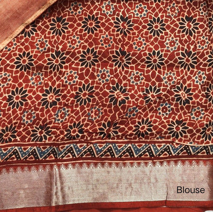 Reddish maroon ajrak hand block printed pure dola silk saree, benarasi zari woven double side borders, hand block printed pallu, running blouse with borders.(DRY CLEAN RECOMMENDED , MILD STAINS AND DYES ARE NOT DEFECTS). NS100