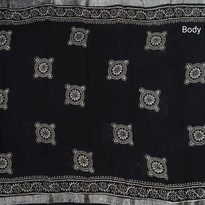 Black block printed linen cotton saree with double side silver zari borders (lightweight,soft) printed pallu with silver zari stripes, plain running blouse with borders. NS105