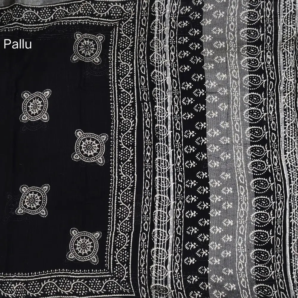 Black block printed linen cotton saree with double side silver zari borders (lightweight,soft) printed pallu with silver zari stripes, plain running blouse with borders. NS105