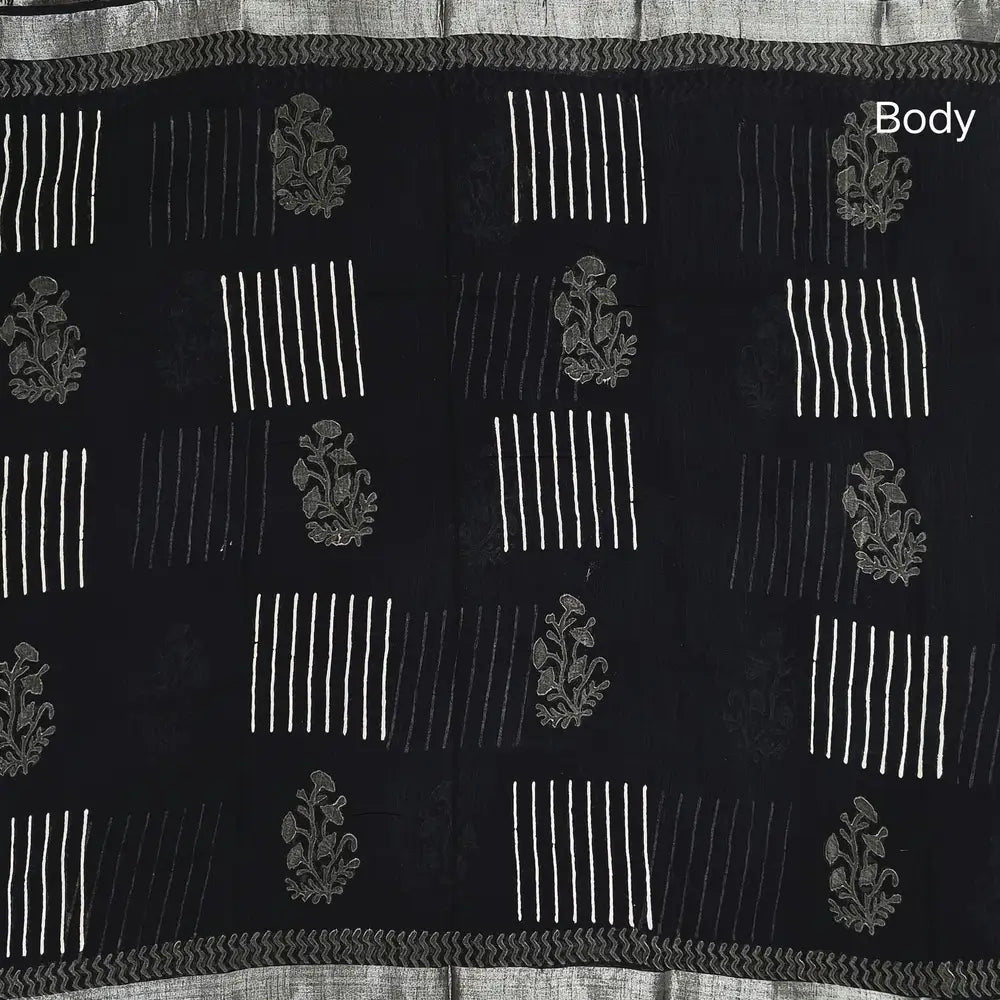 Black block printed linen cotton saree with double side silver zari borders (lightweight,soft) printed pallu with silver zari stripes, plain running blouse with borders. NS106