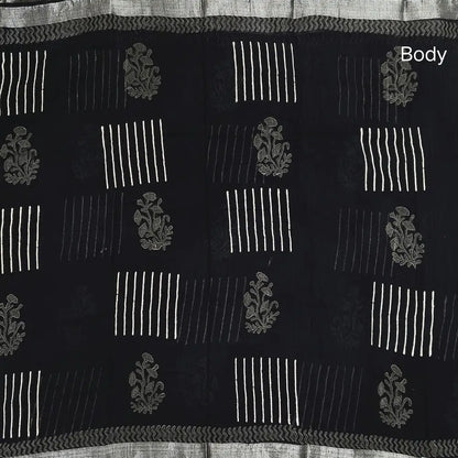 Black block printed linen cotton saree with double side silver zari borders (lightweight,soft) printed pallu with silver zari stripes, plain running blouse with borders. NS106