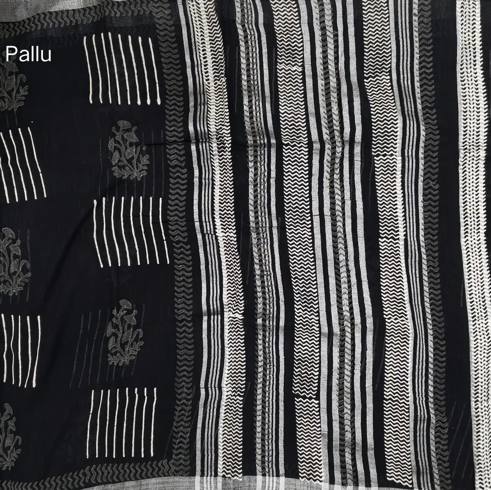 Black block printed linen cotton saree with double side silver zari borders (lightweight,soft) printed pallu with silver zari stripes, plain running blouse with borders. NS106