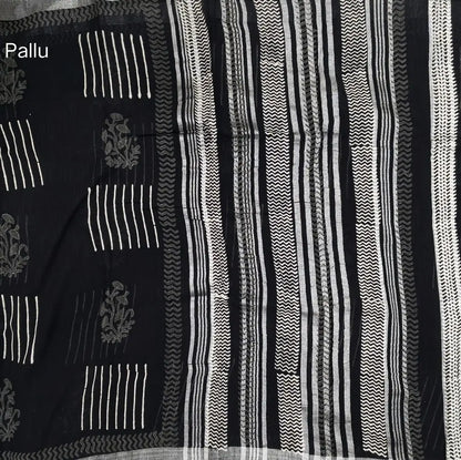 Black block printed linen cotton saree with double side silver zari borders (lightweight,soft) printed pallu with silver zari stripes, plain running blouse with borders. NS106