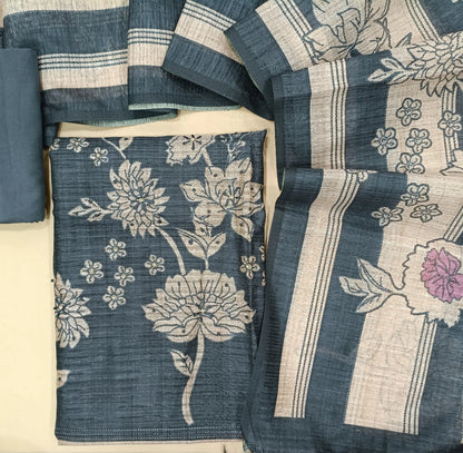 Dark blueish grey digital printed jute silk unstitched salwar material(thin,textured,lining needed)thread embroidery work with floral printed on front,matching spun cotton bottom,printed and stripes on jute silk dupatta. FB262702