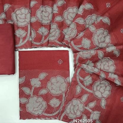 Reddish maroon kota unstitched salwar material,thread embroidery,applique work on daman(Lining Needed) matching silky fabric for both bottom and lining,applique work and floral embroidery on kota dupatta with scallop borders. JN262505