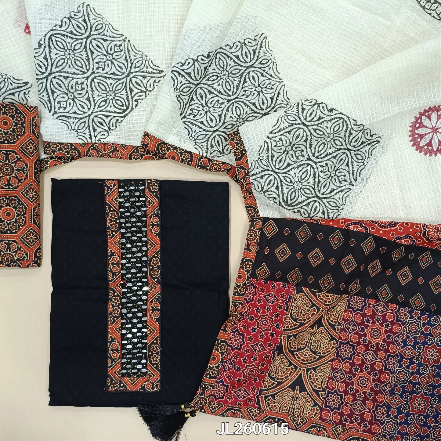 Black dobby cotton unstitched salwar material,ajrak &real mirror work on yoke,self weaving design(ORANGE)(lining needed)ajrak block printed cotton bottom, block printed kota dupatta with applique patch work on pallu. JL260615