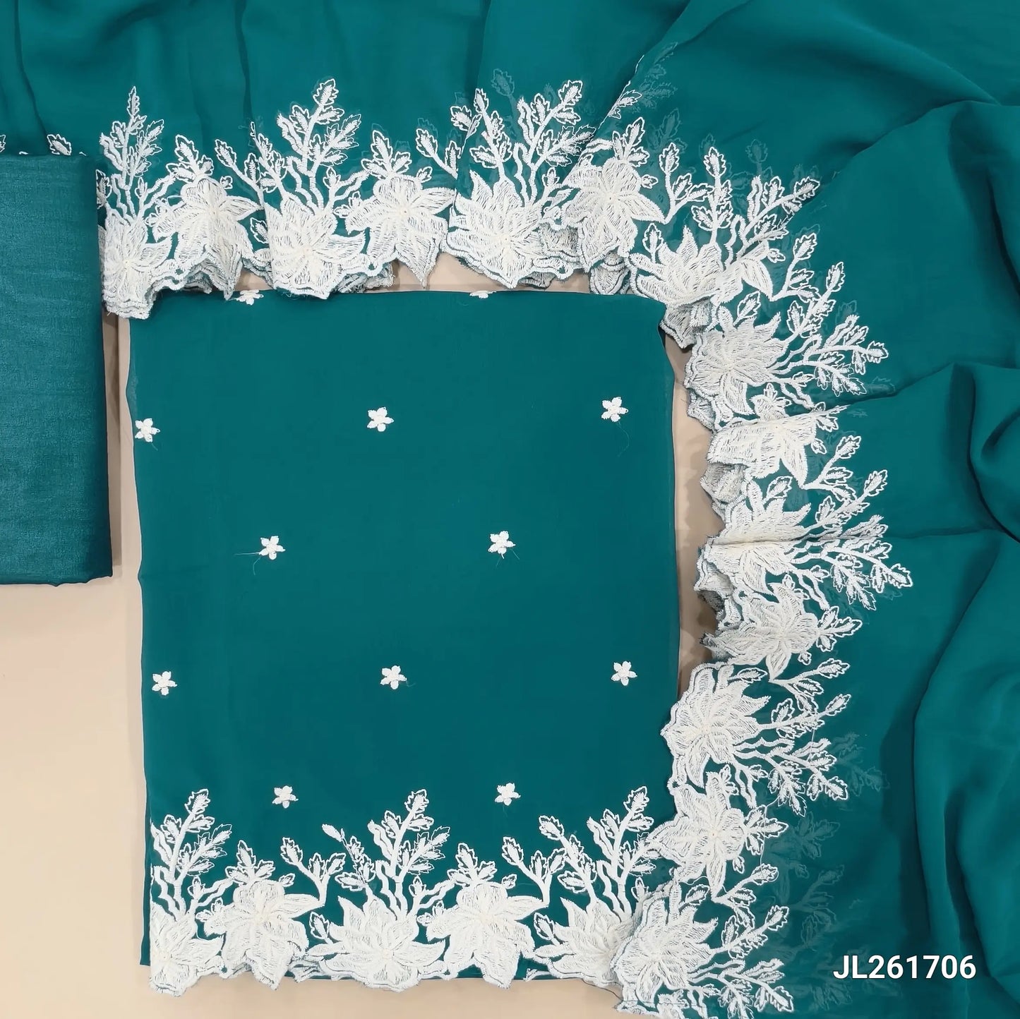 Dark teal blue semi georgette unstitched salwar material, floral embroidery on front,embroidery and cut work daman(soft,Lining Needed)matching silky fabric provided for both bottom and lining,semi georgette with embroidery and cut work borders. JL261706