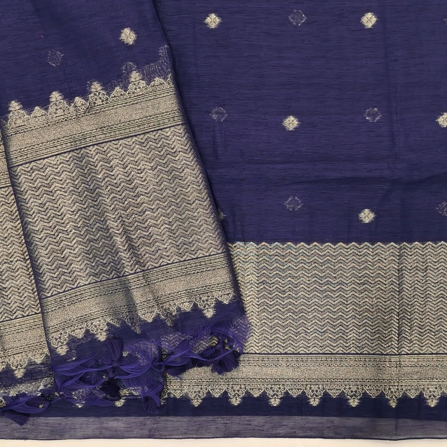 Dark blue jamdani woven premium tussar unstitched salwar material,buttas on front,antic gold zari weaving daman, (Thin, textured, lining needed)silk cotton bottom, buttas on full length tussar dupatta with rich pallu and tassles. JL261710