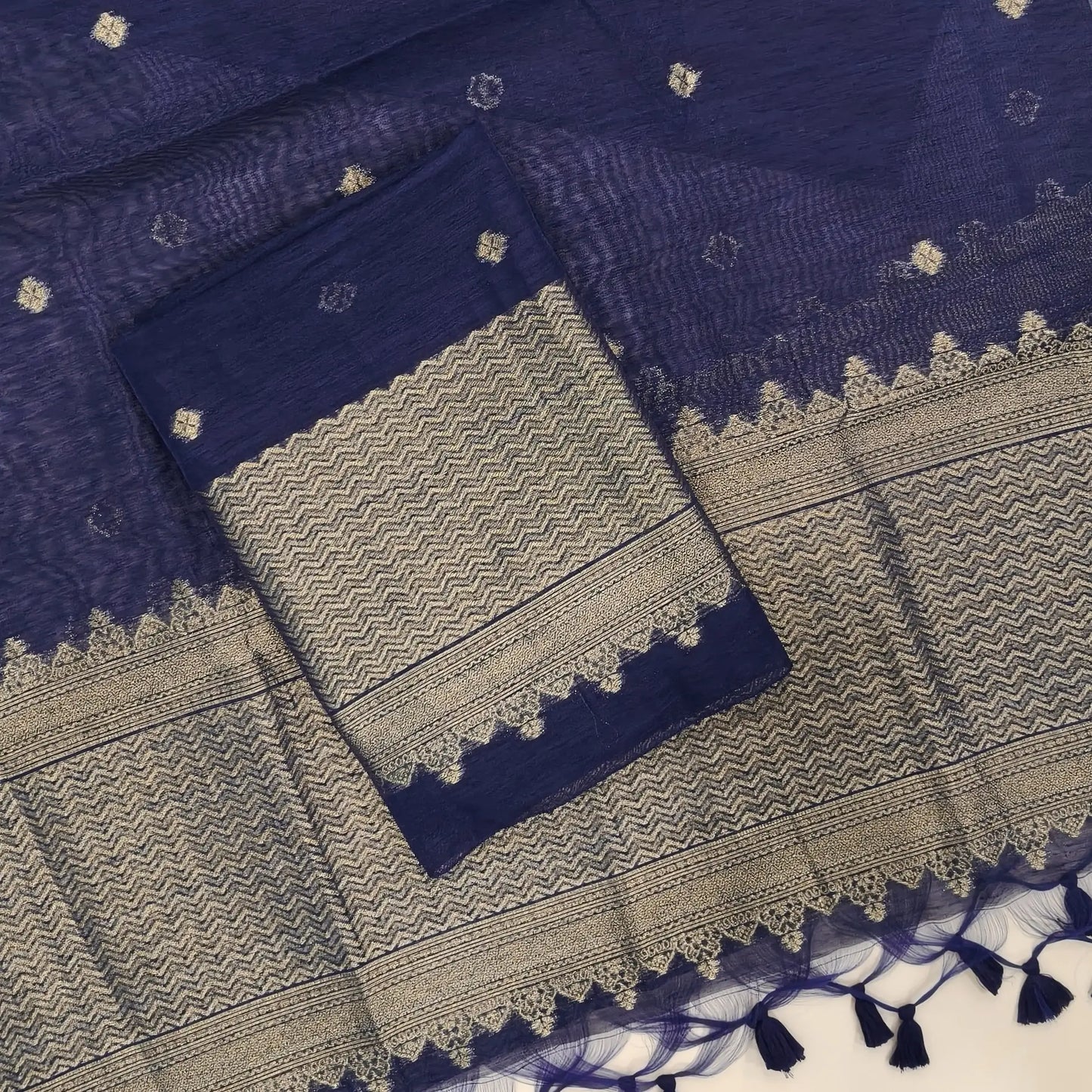 Dark blue jamdani woven premium tussar unstitched salwar material,buttas on front,antic gold zari weaving daman, (Thin, textured, lining needed)silk cotton bottom, buttas on full length tussar dupatta with rich pallu and tassles. JL261710