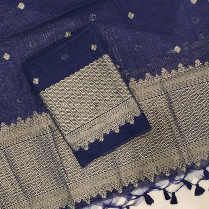 Dark blue jamdani woven premium tussar unstitched salwar material,buttas on front,antic gold zari weaving daman, (Thin, textured, lining needed)silk cotton bottom, buttas on full length tussar dupatta with rich pallu and tassles. JL261710