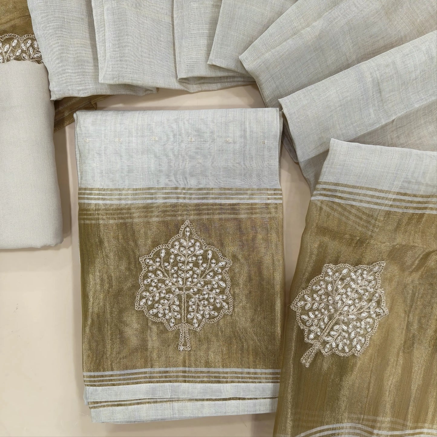 Rich beige premium silk cotton unstitched salwar material,zarodzi and zari work on yoke, zari buttas all over,(lining needed)rich daman, spun cotton bottom, designer premium silk cotton dupatta with rich pallu. JL261701