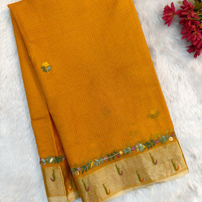 Fenugreek yellow premium kota silk saree(soft, thin)with rich hand embroidery work all over,paithani woven double side borders,rich zari woven pallu,with hand embroidery & sequins work,running blouse with embroidery and borders. NS257