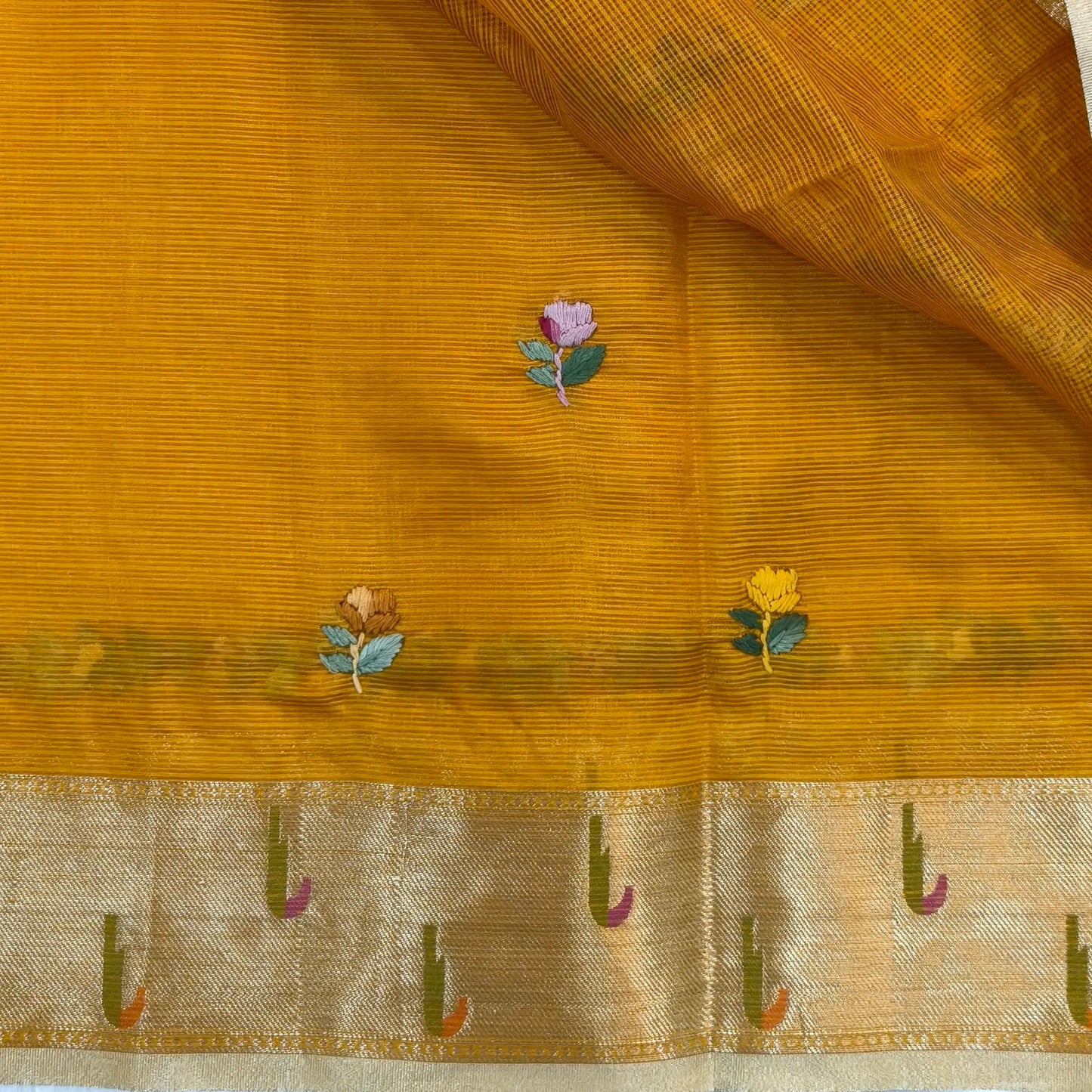 Fenugreek yellow premium kota silk saree(soft, thin)with rich hand embroidery work all over,paithani woven double side borders,rich zari woven pallu,with hand embroidery & sequins work,running blouse with embroidery and borders. NS257