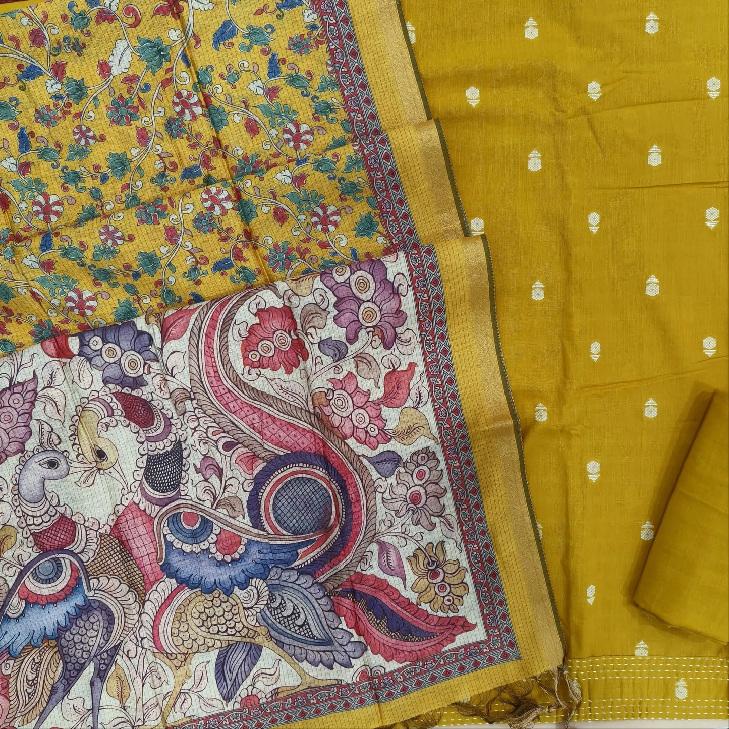 Mehandhi yellow premium handloom cotton unstitched salwar material,thread woven buttas all over, kantha stitch daman,(lining needed)cotton bottom, digital printed premium chanderi silk cotton dupatta with tissue borders. JL261808