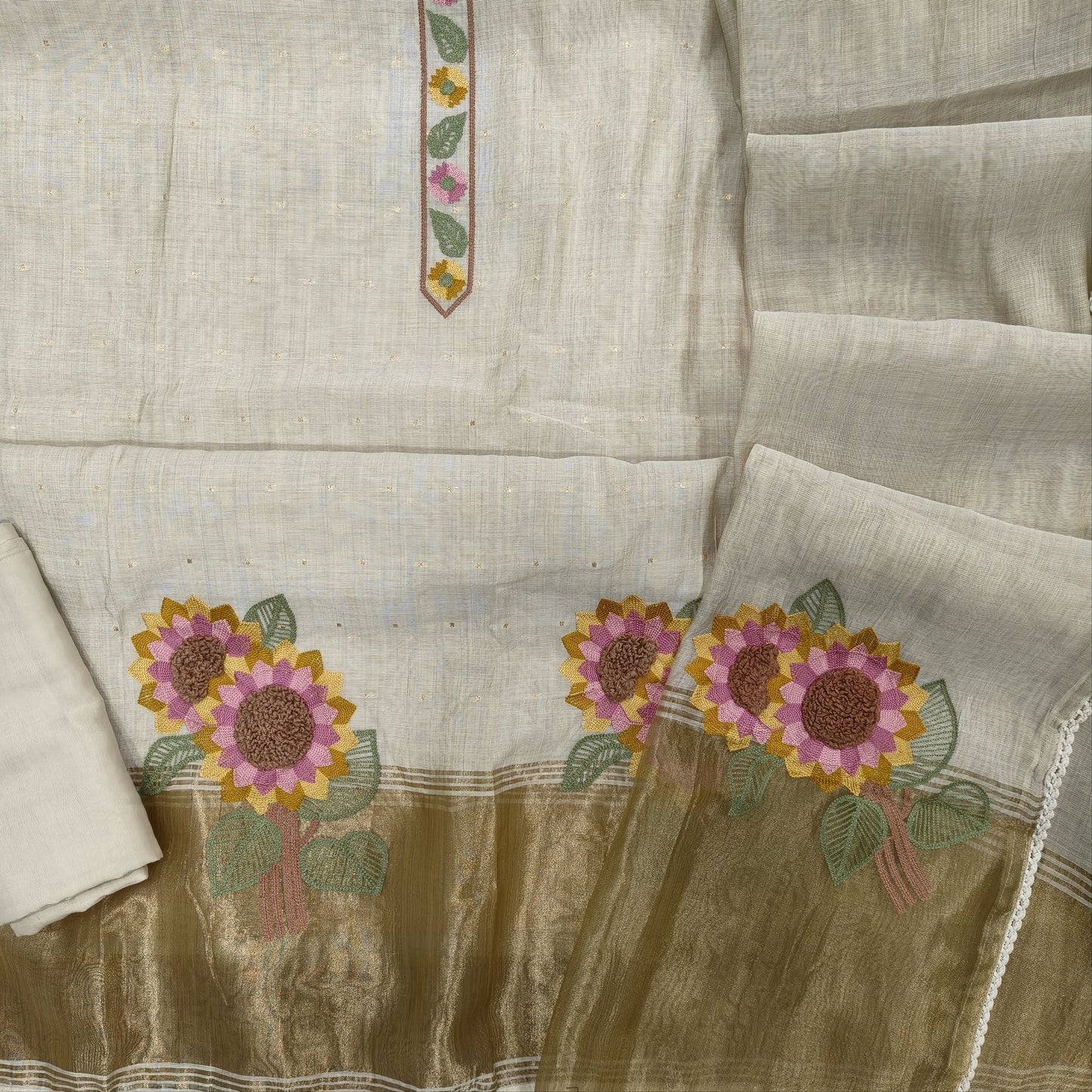 Light beige premium silk cotton unstitched salwar material,embroidery yoke,zari buttas all over,gold tissue and embroidery work on daman,(lining needed)spun cotton bottom, silk cotton dupatta with embriodery work with tissue pallu.JL261901