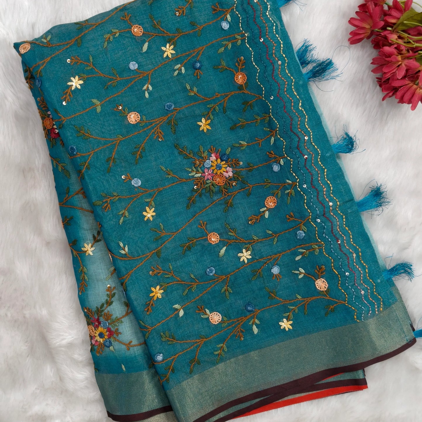 Teal blue with golden tint premium dual shaded tissue linen saree, with rich hand embroidery work all over(texture)double side tissue borders,contrast pallu, with rich hand embroidery and sequins work, running blouse with embroidery & borders. NS264