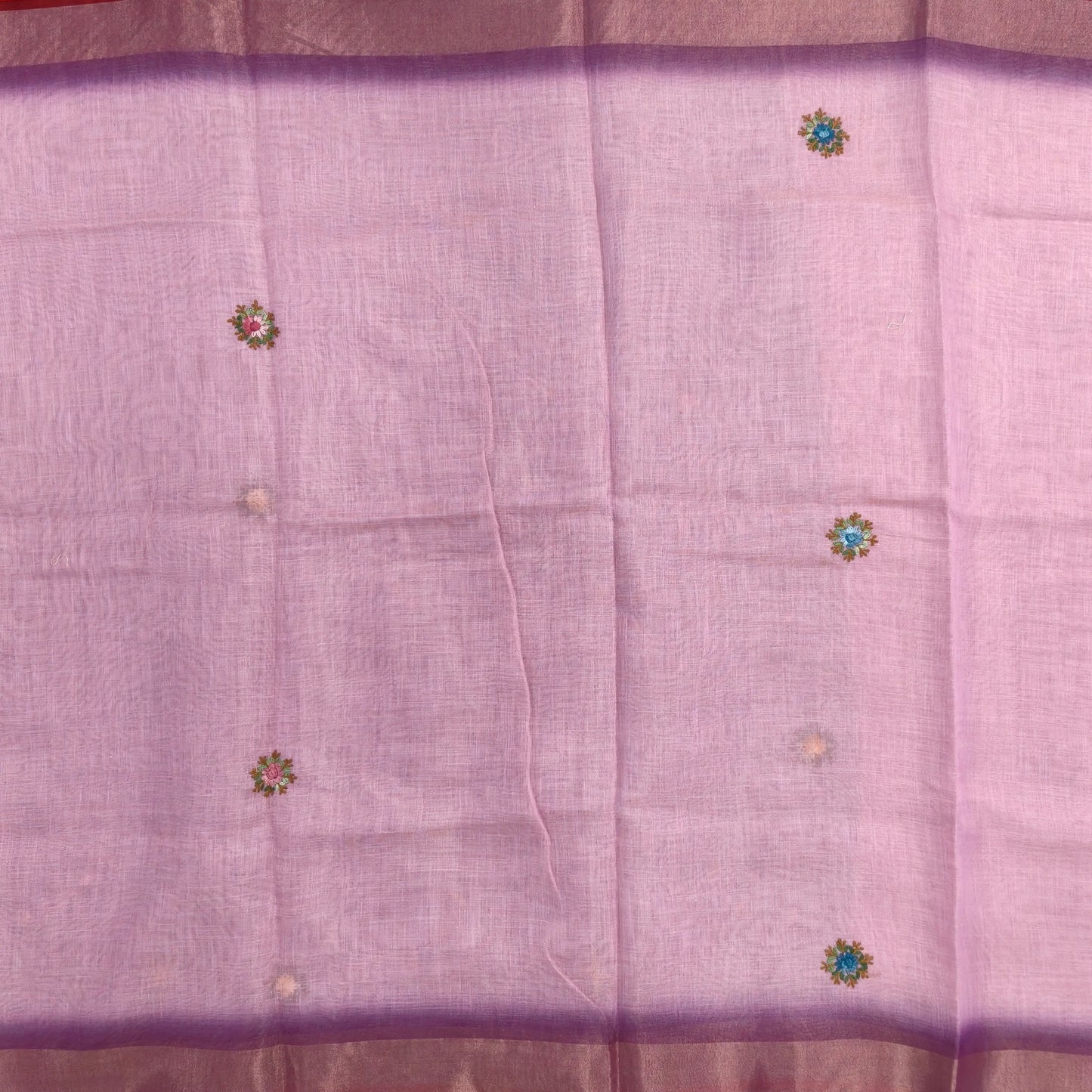 Purple with golden tint premium dual shaded tissue linen saree, with rich hand embroidery work all over(texture)double side tissue borders,contrast pallu, with rich hand embroidery and sequins work, running blouse with embroidery & borders. NS265