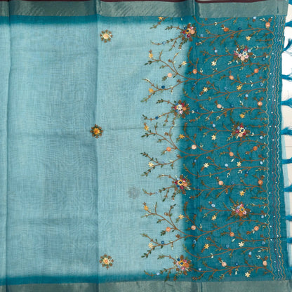 Teal blue with golden tint premium dual shaded tissue linen saree, with rich hand embroidery work all over(texture)double side tissue borders,contrast pallu, with rich hand embroidery and sequins work, running blouse with embroidery & borders. NS264