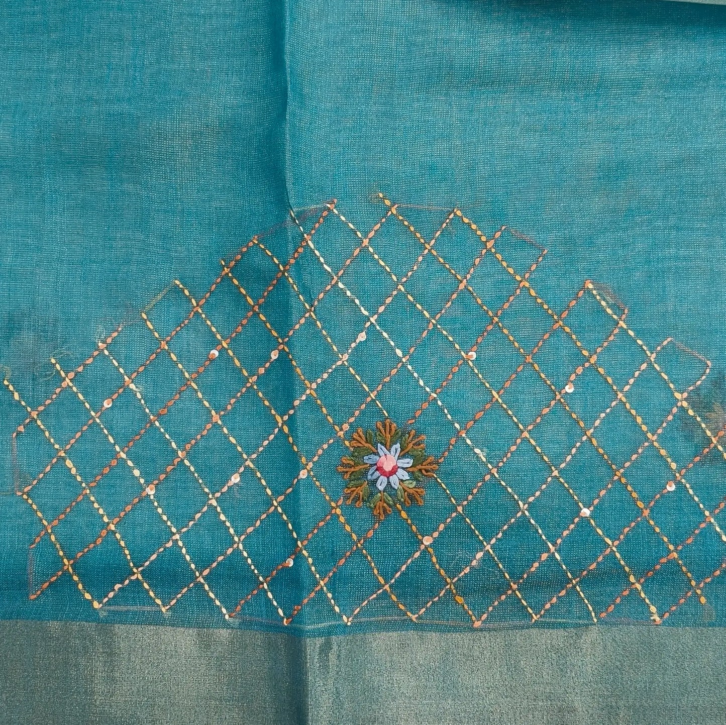 Teal blue with golden tint premium dual shaded tissue linen saree, with rich hand embroidery work all over(texture)double side tissue borders,contrast pallu, with rich hand embroidery and sequins work, running blouse with embroidery & borders. NS264