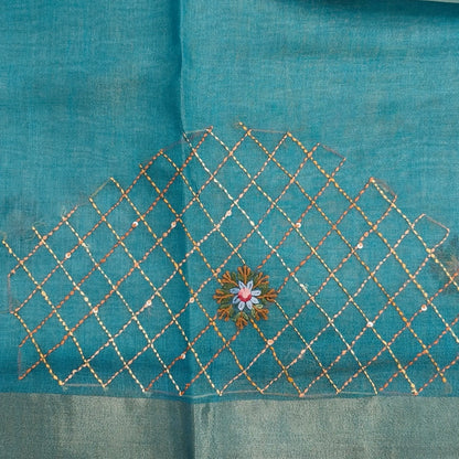 Teal blue with golden tint premium dual shaded tissue linen saree, with rich hand embroidery work all over(texture)double side tissue borders,contrast pallu, with rich hand embroidery and sequins work, running blouse with embroidery & borders. NS264