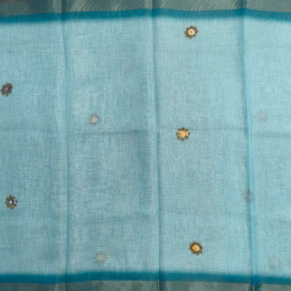 Teal blue with golden tint premium dual shaded tissue linen saree, with rich hand embroidery work all over(texture)double side tissue borders,contrast pallu, with rich hand embroidery and sequins work, running blouse with embroidery & borders. NS264