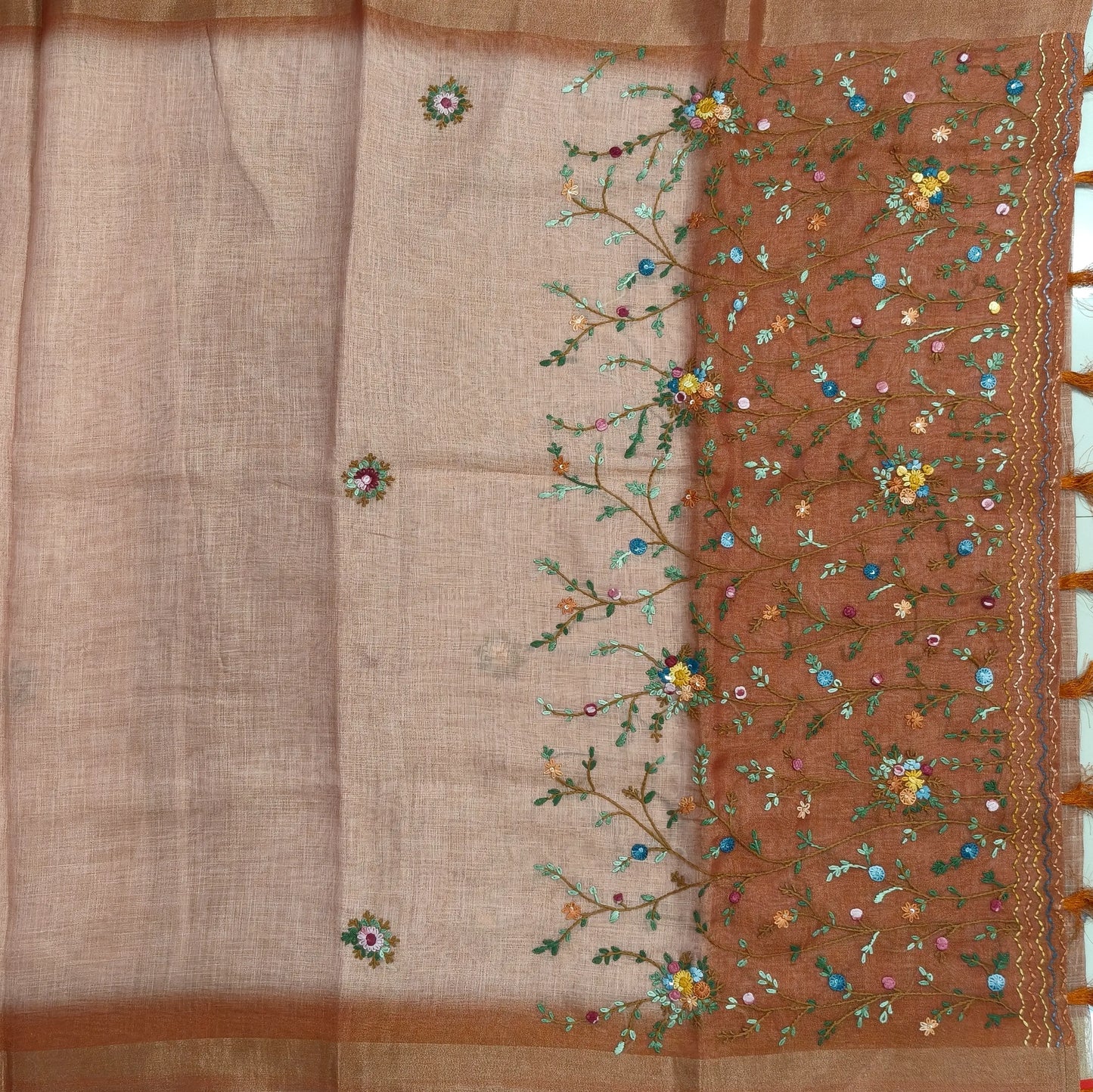 Rust orange with golden tint premium dual shaded tissue linen saree, with rich hand embroidery work all over(texture)double side tissue borders,contrast pallu, with rich hand embroidery and sequins work, running blouse with embroidery & borders. NS266