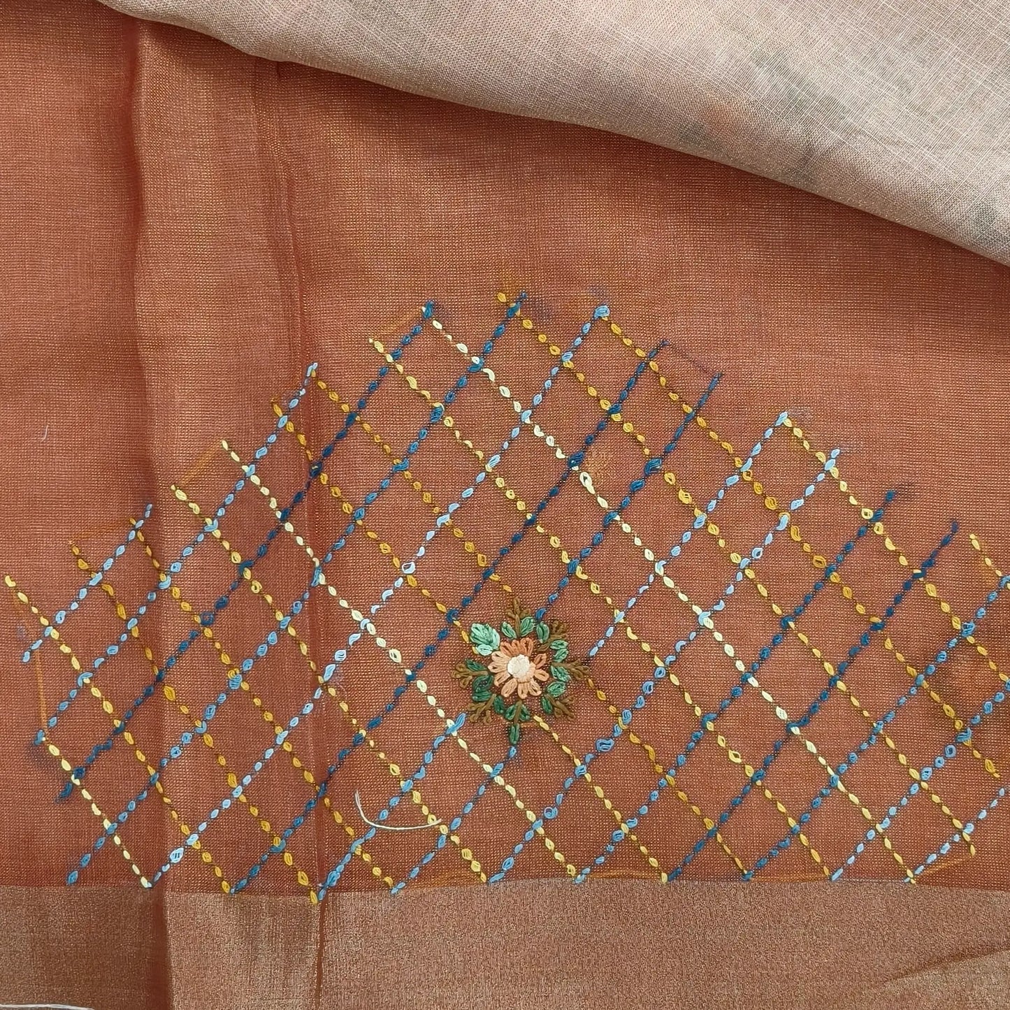 Rust orange with golden tint premium dual shaded tissue linen saree, with rich hand embroidery work all over(texture)double side tissue borders,contrast pallu, with rich hand embroidery and sequins work, running blouse with embroidery & borders. NS266