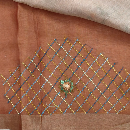 Rust orange with golden tint premium dual shaded tissue linen saree, with rich hand embroidery work all over(texture)double side tissue borders,contrast pallu, with rich hand embroidery and sequins work, running blouse with embroidery & borders. NS266