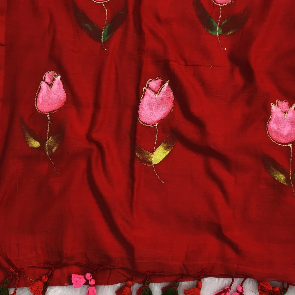 Bright red soft mul mul cotton saree(soft, light weight)with hand brush paint work all over,handmade tassles in pallu, running blouse. NS281