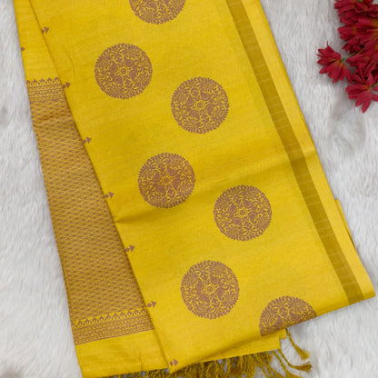 CODE NS10 : Bright mehandhi yellow printed chappa silk saree, jakard design all over, chakra print with gold tissue borders, printed short pallu with tassels, vertical striped running blouse.