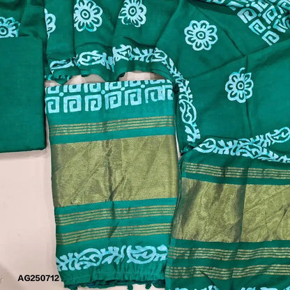 Turquoise green original batik dyed fancy silk cotton unstitched salwar material(lining needed) tissue borders on daman, matching silky bottom, batik dyed fancy silk cotton dupatta with tissue border on pallu, pompom tapings. AG260712