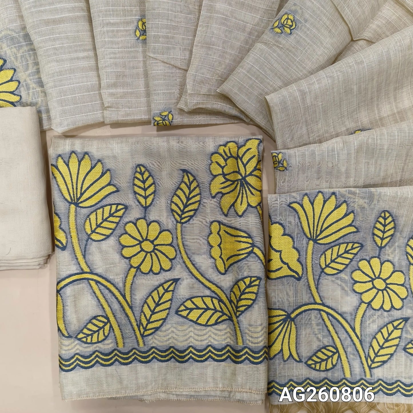 Light beige base soft silk cotton unstitched salwar material,buttas on front,thread woven on daman,YELLOW(Lining Needed)spun cotton bottom, buttas on soft silk cotton dupatta with thread woven pallu. AG260806