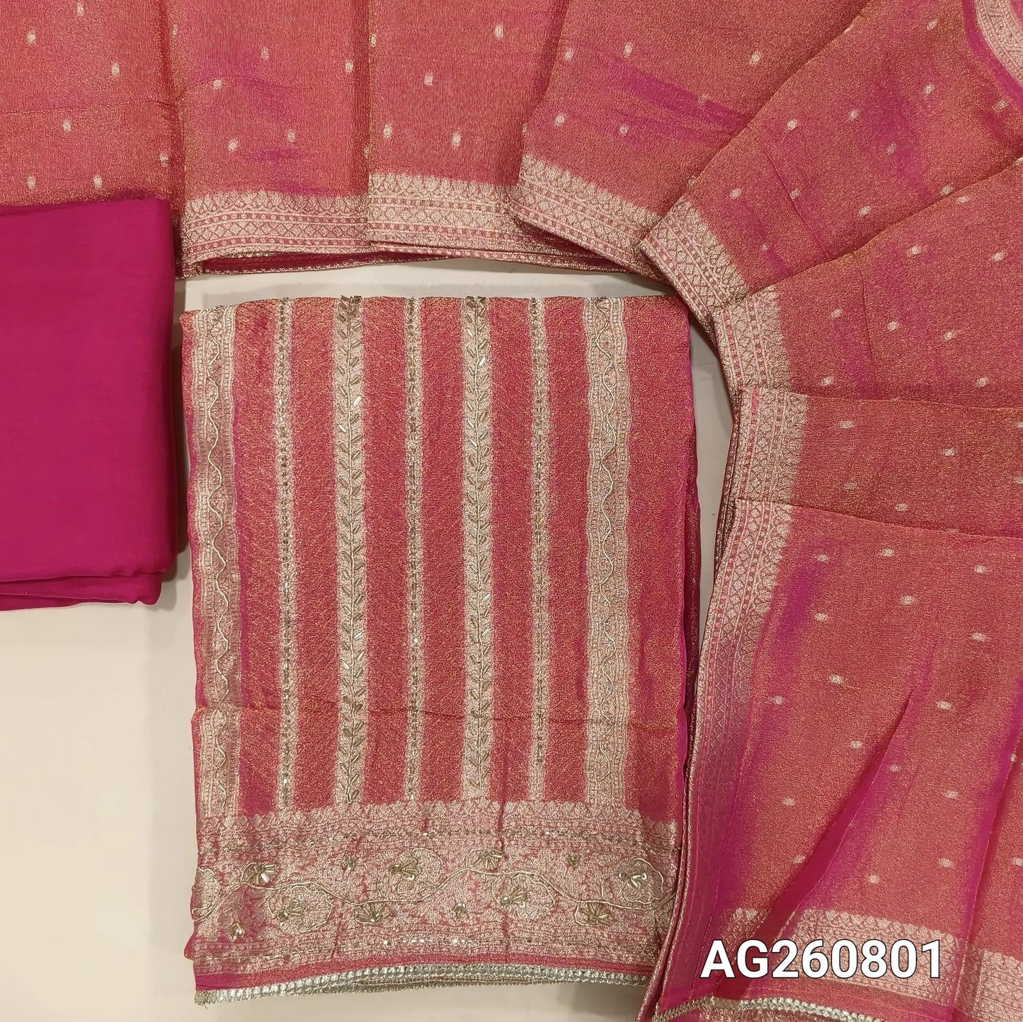 Bright pink with golden tint jakard tissue silk cotton unstitched salwar material,self design all over,cut bead and zardozi work on front, panel design, (Lining Needed)santoon bottom, tissue silk dupatta with zari woven borders. AG260801