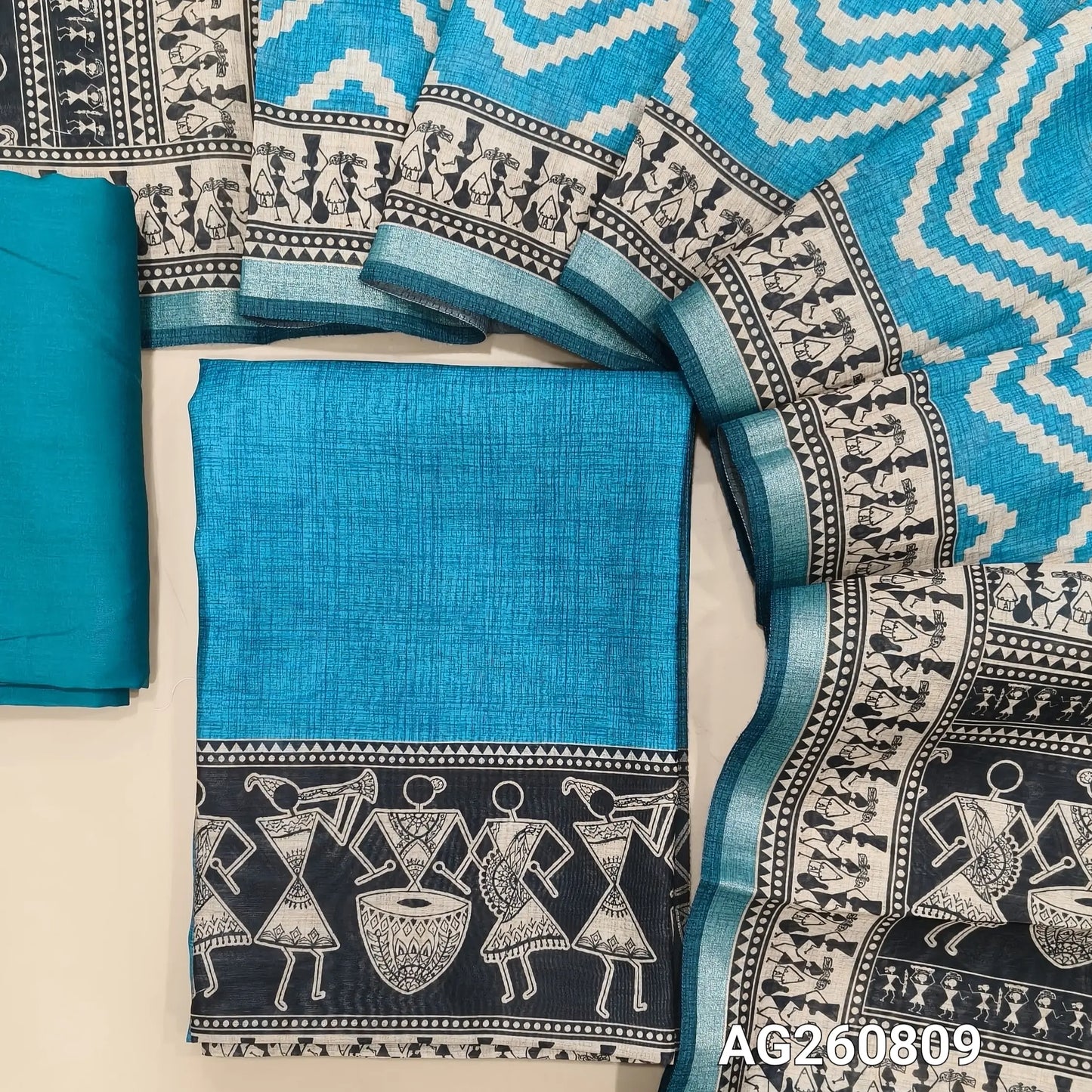 Turquoise blue digital printed silk cotton unstitched salwar material,warli printed daman, (Lining Needed)spun cotton bottom, zig zag digital printed silk cotton dupatta with warli printed pallu. AG260809