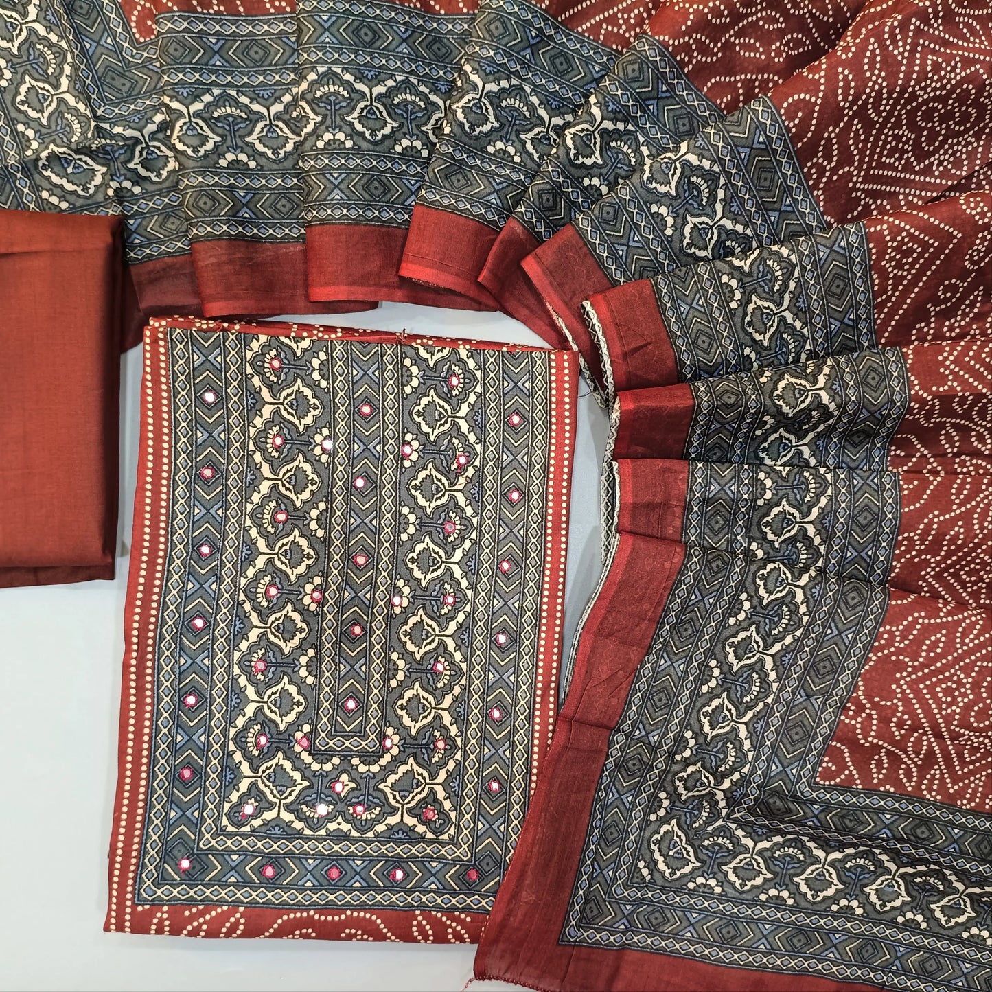Maroon bandhini printed soft cotton unstitched salwar material, printed contrast yoke and daman (Lining Needed0matching spun cotton bottom, diital printed soft mul cotton dupatta. SP260628