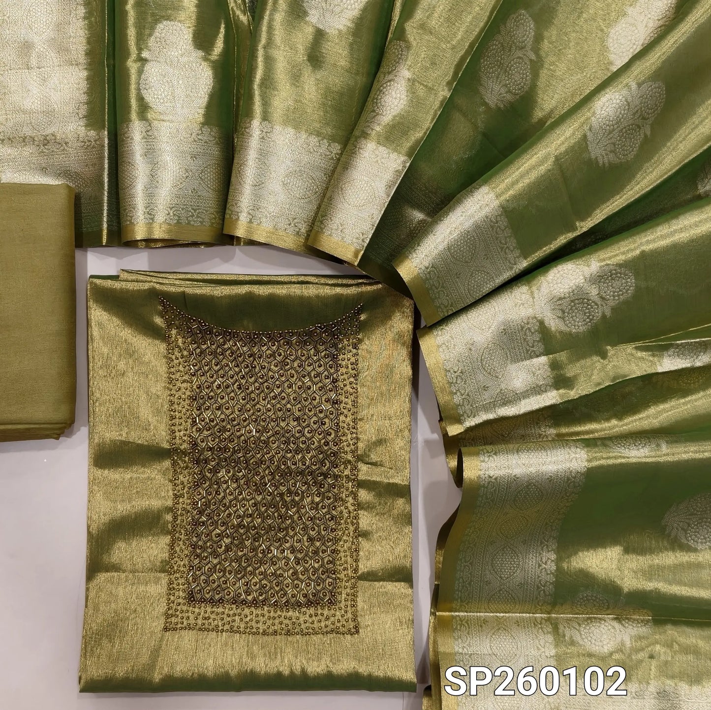 Green with golden tint premium tissue silk unstitched salwar material, rich cut bead and sugar bead detailing on yoke (Shimmer, Lining Needed) Matching santoon bottom, tissue silk benarasi zari woven dupatta. SP260102
