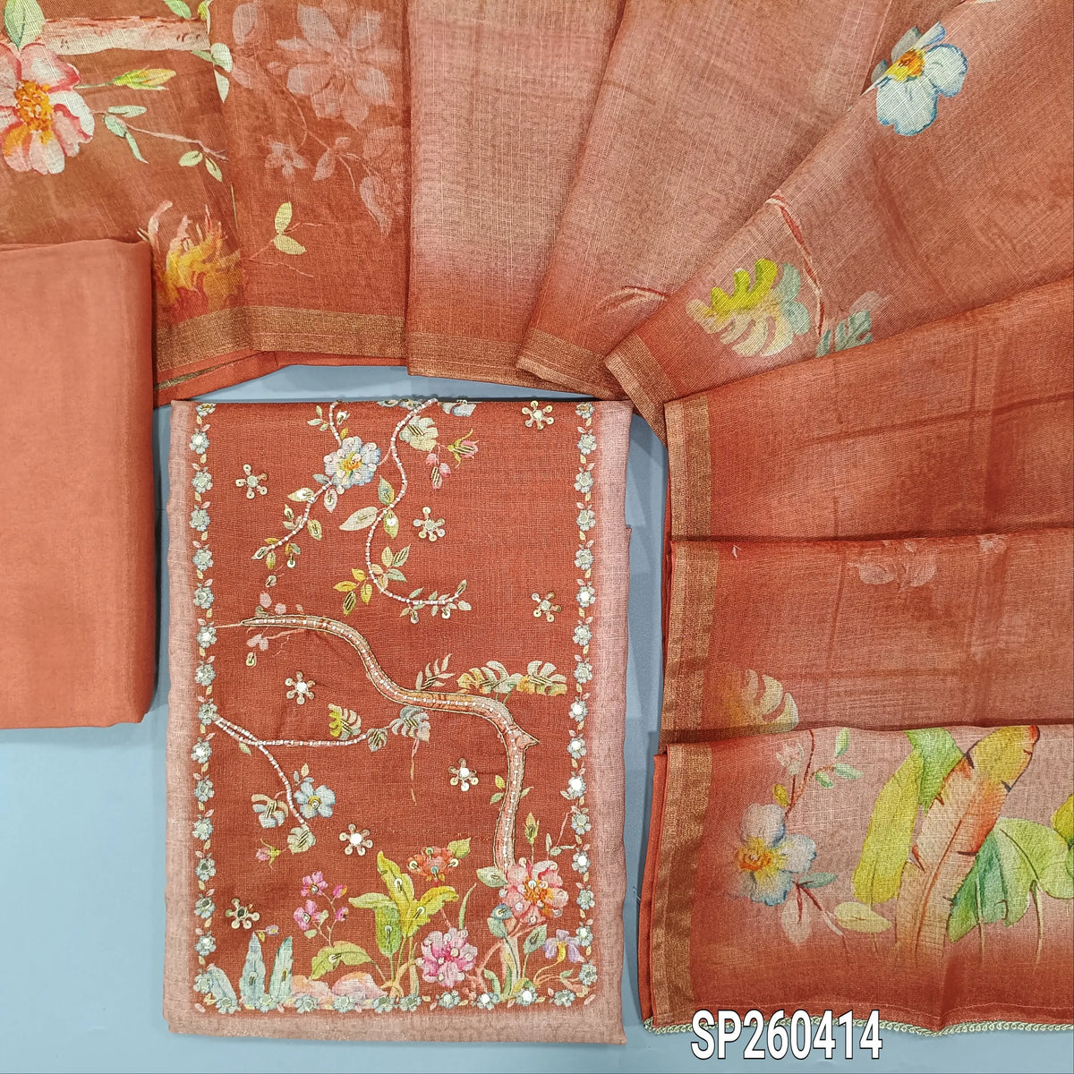 Peach tissue linen digital printed unstitched salwar material, bead and embroidery detailing on yoke (Textured, Lining Needed) matching spun cotton bottom, digital printed tissue linen dupatta. SP260414