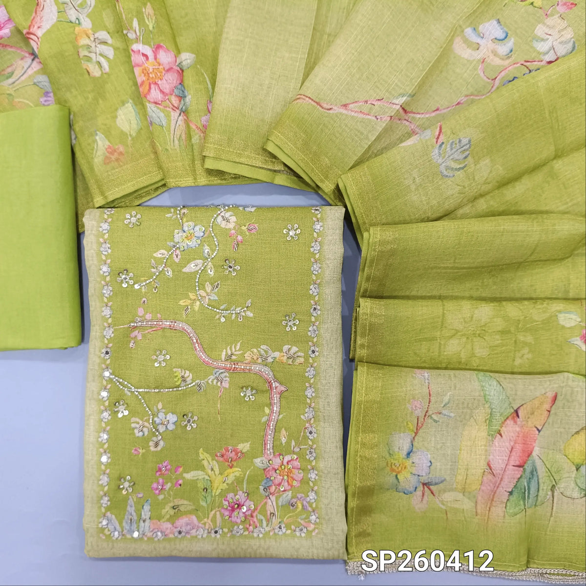 Green tissue linen digital printed unstitched salwar material, bead and embroidery detailing on yoke (Textured, Lining Needed) matching spun cotton bottom, digital printed tissue linen dupatta. SP260412