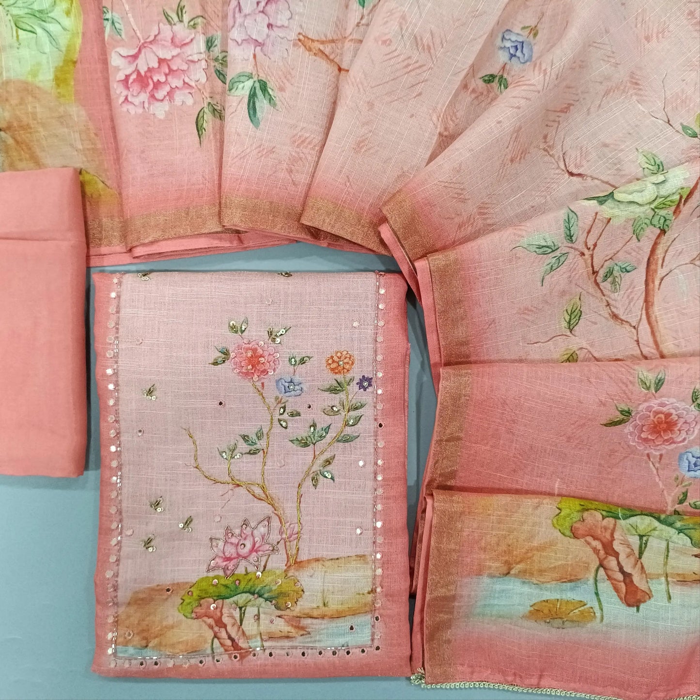 Peachish Pink digital printed dual shaded tissue linen unstitched salwar material, cut bead and embroidery on yoke (Textured, Lining Needed) Matching Santoon Bottom, digital printed tissue linen dupatta. SP260208