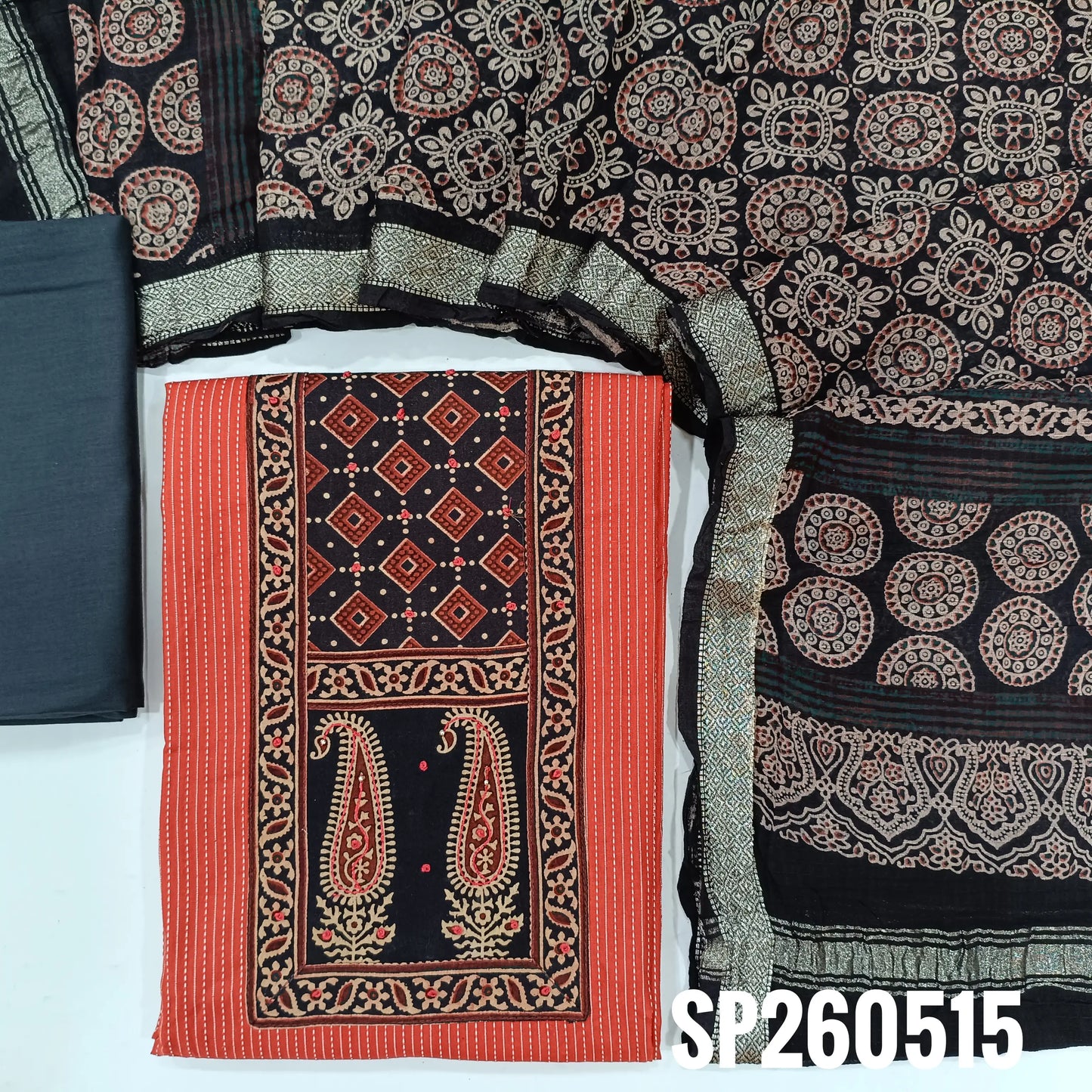 Bright peachish pink and black pure soft kantha cotton unstitched salwar material, ajrak yoke patch with french knot work (Lining Optional)matching cotton bottom, ajrak hand block printed mul cotton dupatta. TAPINGS NEEDED. SP260515