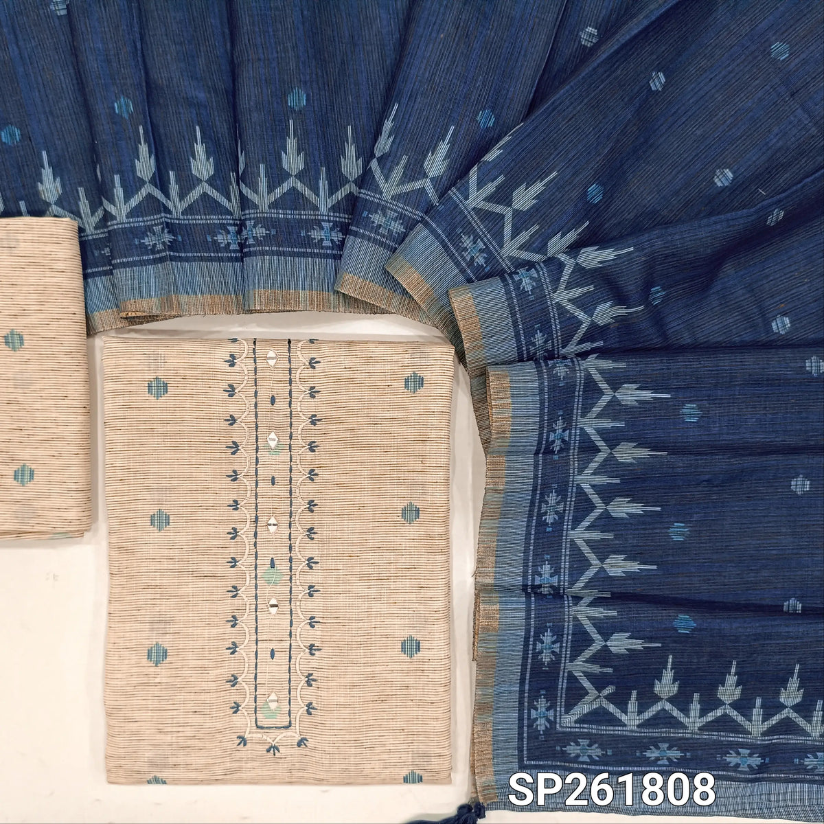 Off white base jute linen unstitched salwar material, thread embroidery and real mirror on yoke, printed all over, printed daman,(ROYAL BLUE,Textured, Lining Needed) jute linen bottom,printed semi linen dupatta with tissue borders. SP261808