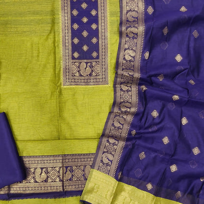 Leafy green and dark purple premium silk cotton benarasi zari woven unstitched salwar material, zari weaving on yoke&daman(Lightweight, Lining Needed)matching silk cotton bottom, zari wove silk cotton dupatta. SP261611