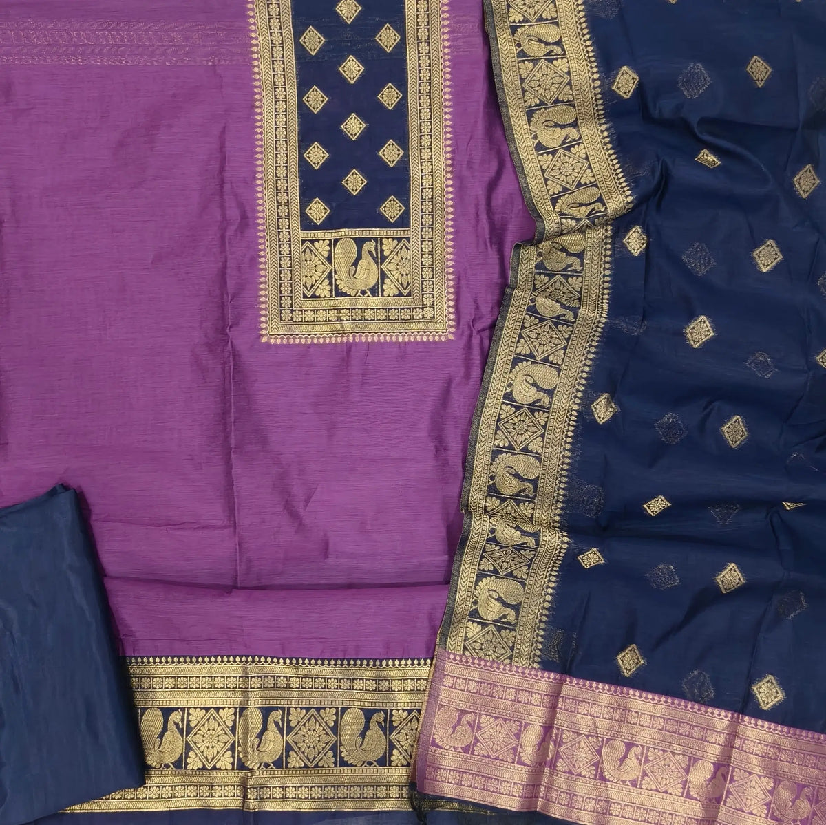 Purple and dark blue premium silk cotton benarasi zari woven unstitched salwar material, zari weaving on yoke&daman(Lightweight, Lining Needed)matching silk cotton bottom, zari wove silk cotton dupatta. SP261609