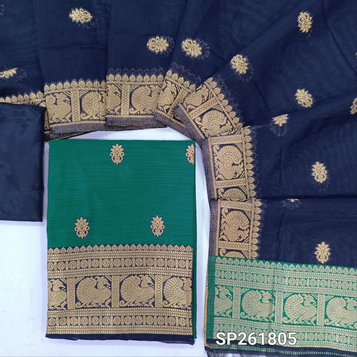 Teal blue premium silk cotton unstitched salwar material,buttas all over benarasi zari weaving daman, (lining needed)dark blue silky bottom,buttas on silk cotton dupatta with pallu and borders. SP261805