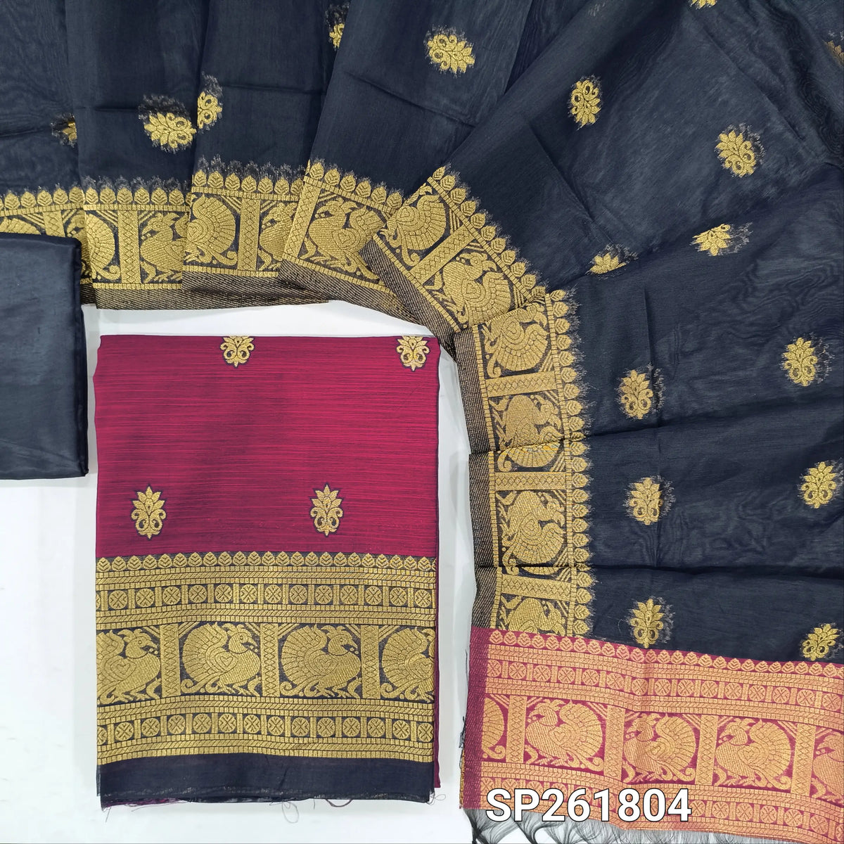 Rani pink premium silk cotton unstitched salwar material,buttas all over benarasi zari weaving daman, (lining needed)dark blue silky bottom,buttas on silk cotton dupatta with pallu and borders. SP261804