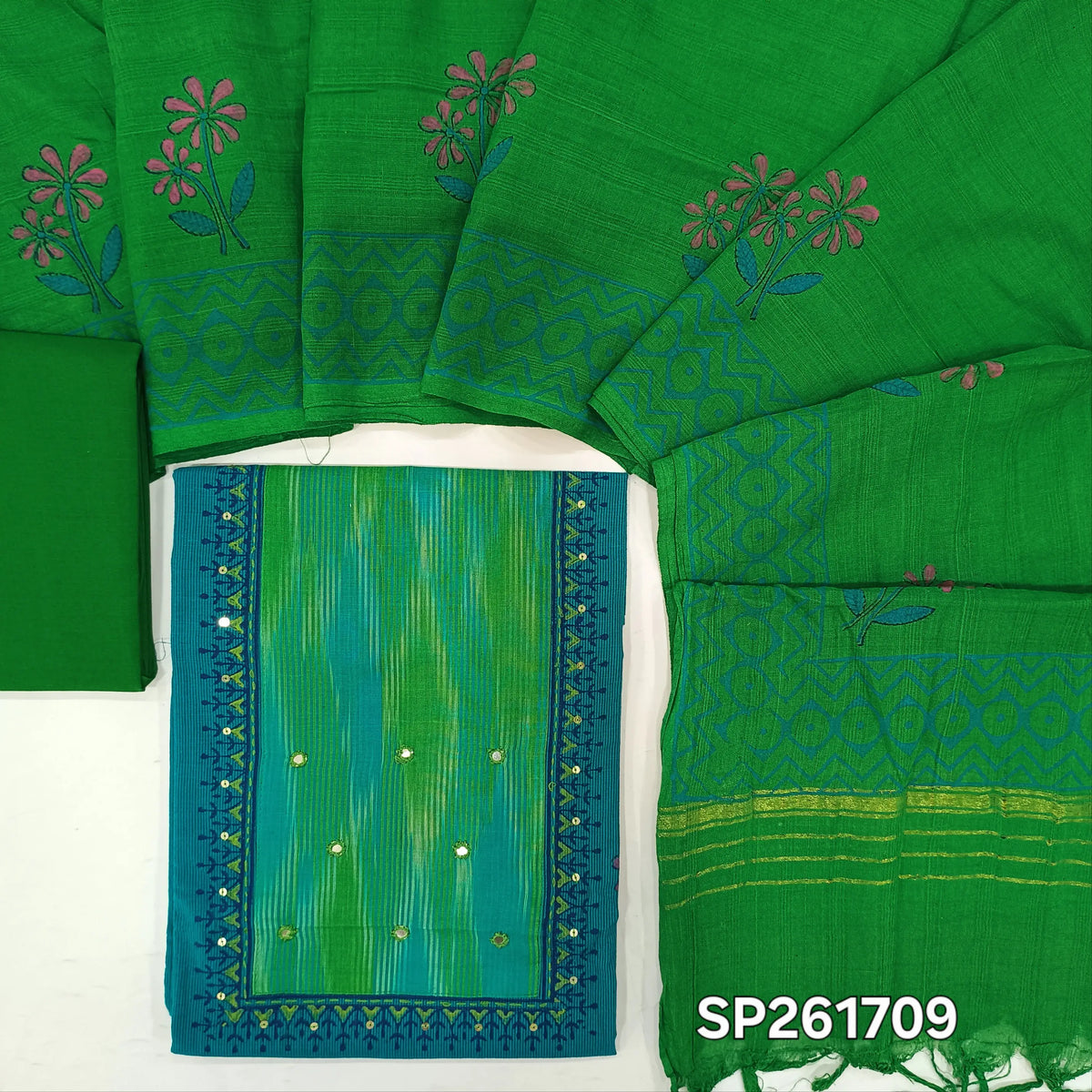 Turquoise blue with green handloom cotton unstitched salwar material, hand block prints on front, real mirror and ikat yoke patch (Lining Optional)pure cotton bottom, mul cotton dupatta with hand block prints and zari detailing. SP261709