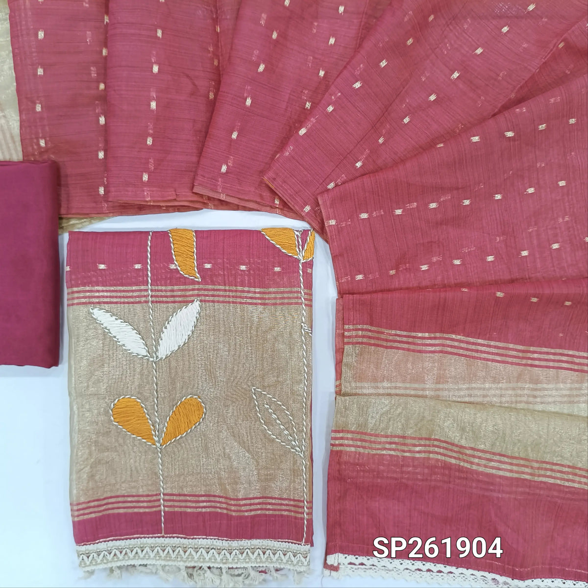 Pink silk cotton unstitched salwar material, V neck, zari buttas all over, thread embroidery with tissue daman,(lining needed) spun cotton bottom, zari buttas on silk cotton dupatta with gold tissue pallu. SP261904