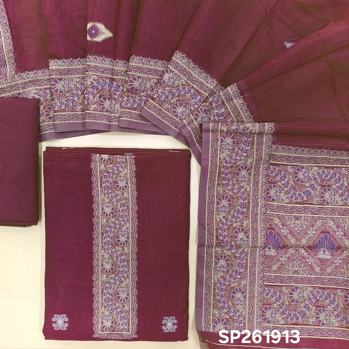 Rani pink silk cotton unstitched salwar material,buttas all over, thread weaving on yoke and daman,(lining needed)silky bottom, silk cotton dupatta with rich thread woven pallu and borders. SP261913