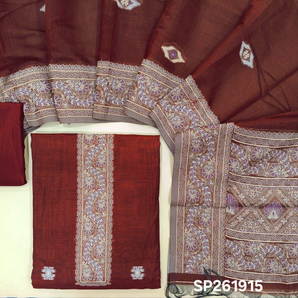 Reddish maroon silk cotton unstitched salwar material,buttas all over, thread weaving on yoke and daman,(lining needed)silky bottom, silk cotton dupatta with rich thread woven pallu and borders. SP261915