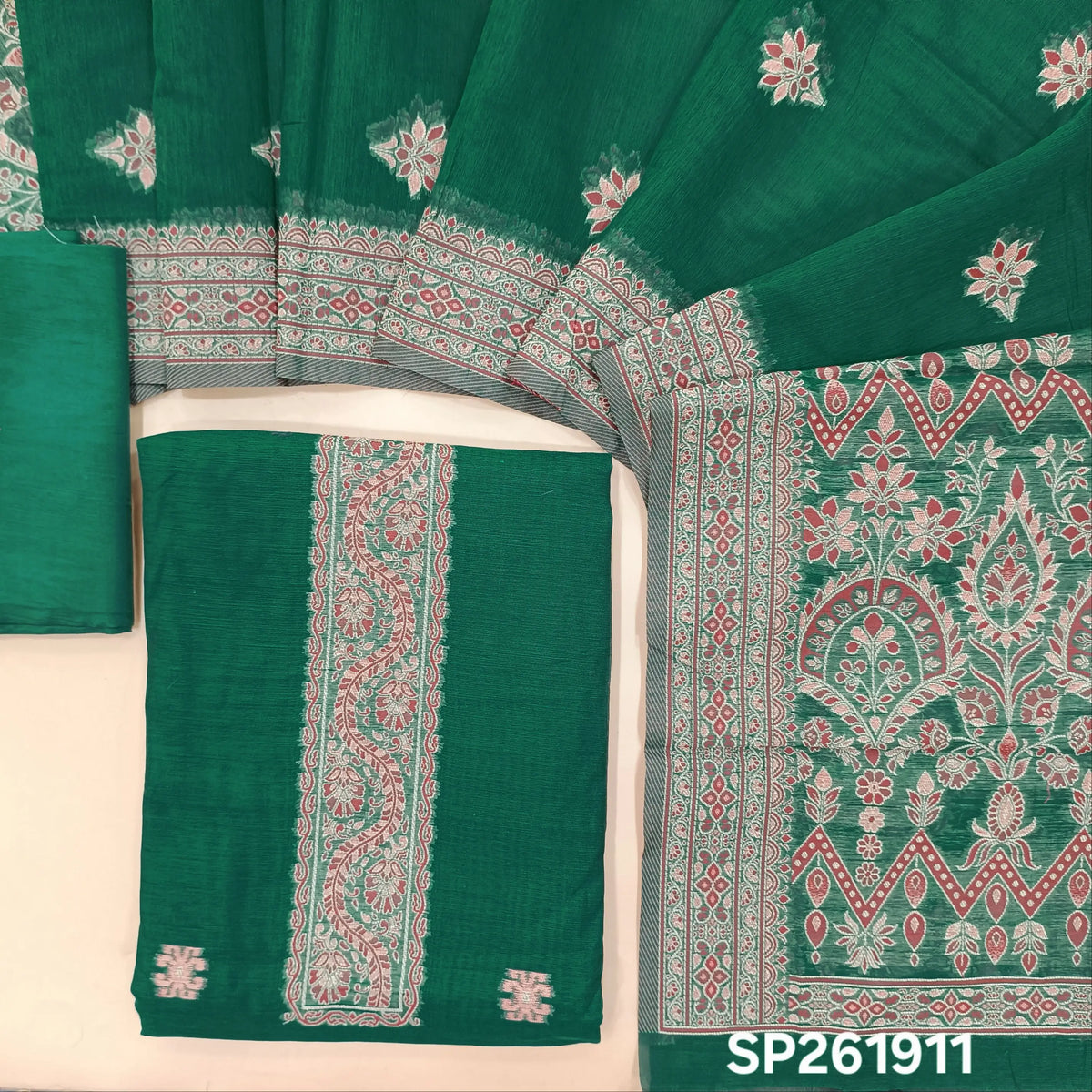 Dark teal green silk cotton unstitched salwar material,buttas all over, thread weaving on yoke and daman,(lining needed)silky bottom, silk cotton dupatta with rich thread woven pallu and borders. SP261911